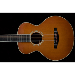 Santa Cruz Firefly Pre-owned. Indian rosewood back and sides. One tiny pin sized dent in top $4499