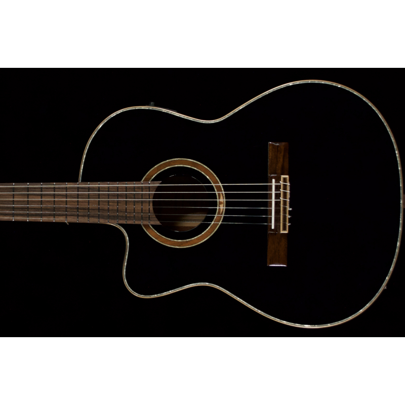 Ortega RCE 138SBBKL. Slim Neck  solid top Classical cutaway with onboard electronics and tuner. Deluxe bag. $649